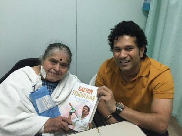 Sachin's first copy of his book to mom Sachin's first copy of his book to mom