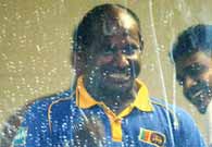 Sri Lankan captain Sanath Jayasuriya celebrates his team's qualification into the Super Sixes