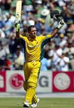 Ponting raises his arms after his century